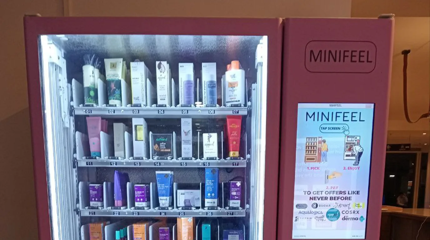 Naloxone vending machine outside a public library entrance at dusk