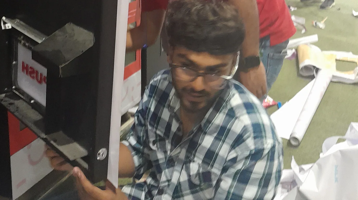 Operator observing foot traffic near a vending machine in a busy location