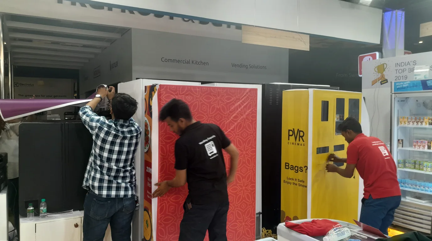 Vending operator restocking a modern machine, illustrating income and job creation